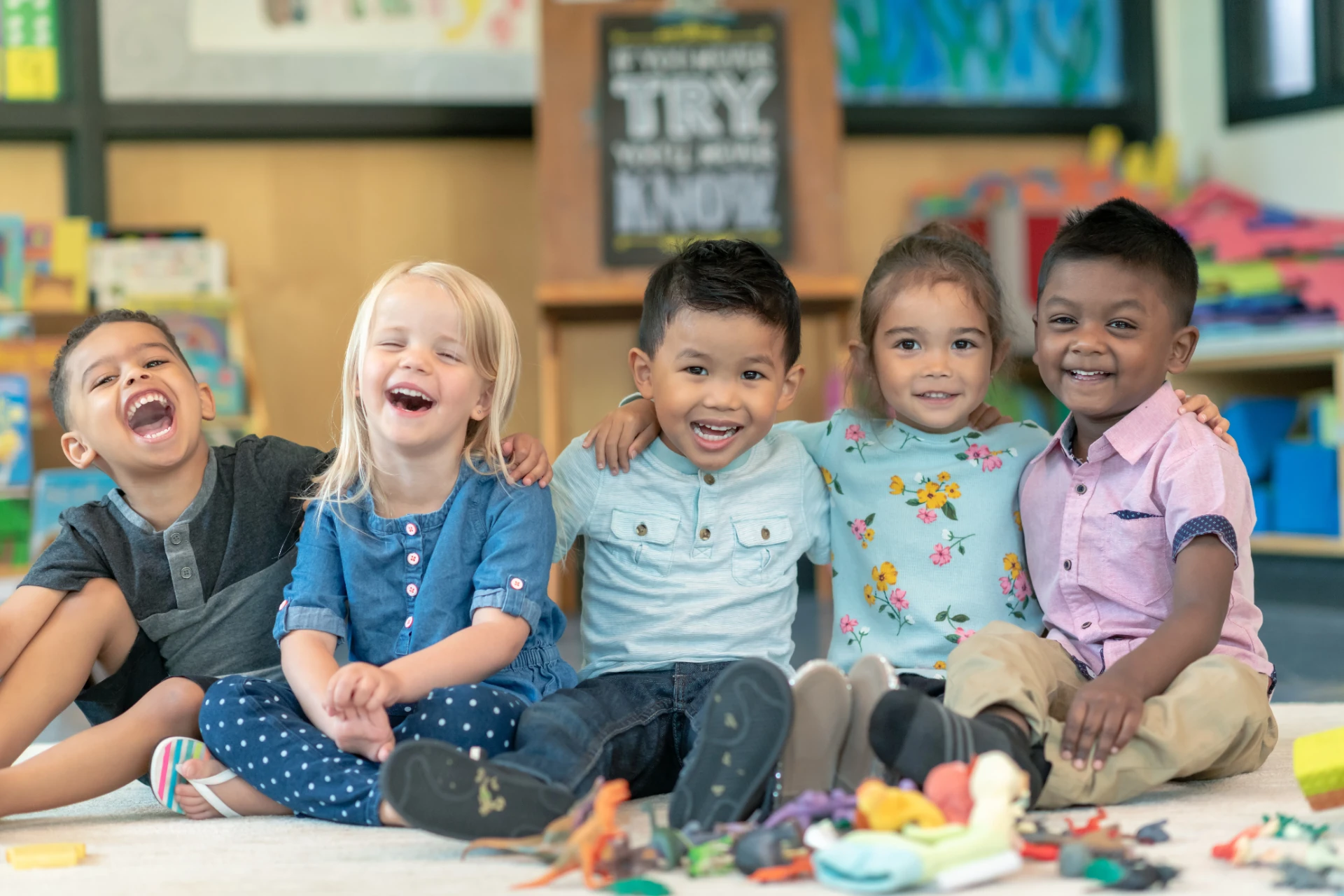 A group of happy children sitting together and laughing