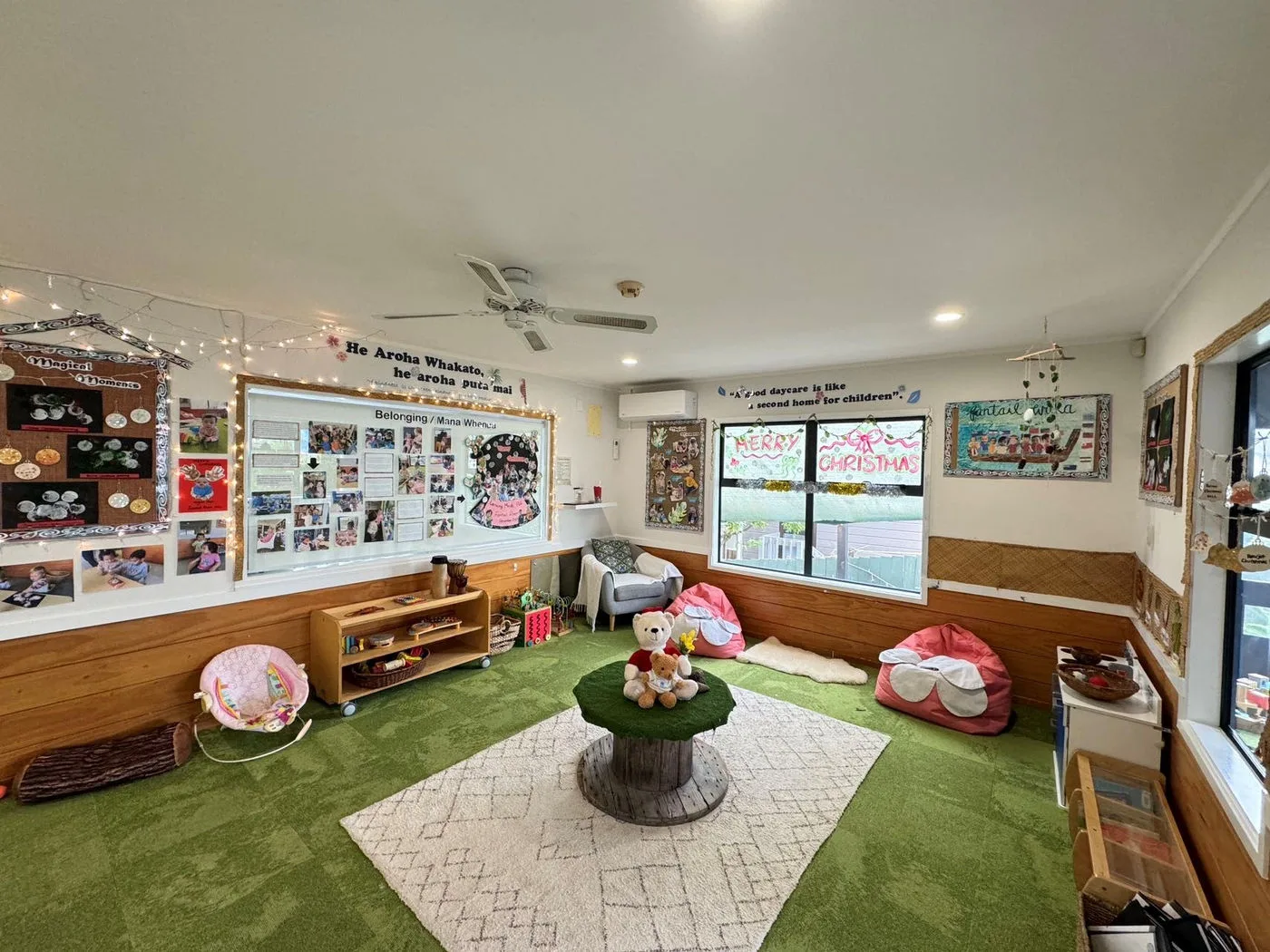 The Fantail Room at Growing Minds set up for babies and toddlers with low shelving, soft rugs and natural light